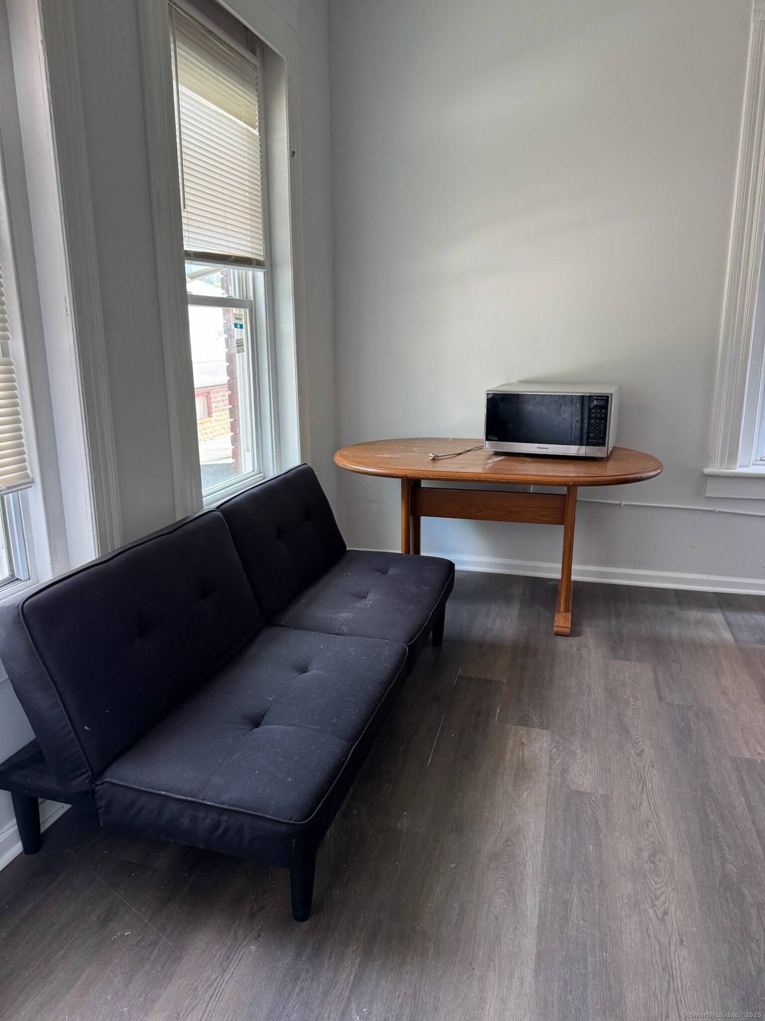 81 West Main Street, Unit 8 Meriden, CT 06451 - Photo 3 of 4 a living room with furniture and a rug