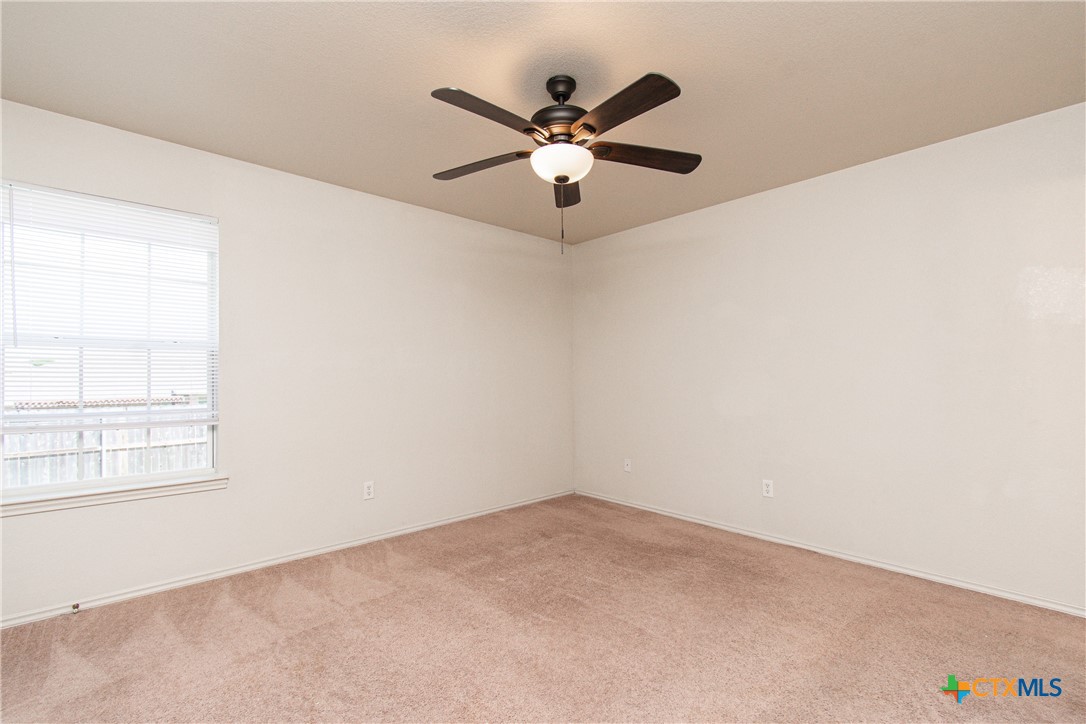6509 Temora Loop, Unit A Killeen, TX 76549 - Photo 15 of 19 an empty room with windows and ceiling fan