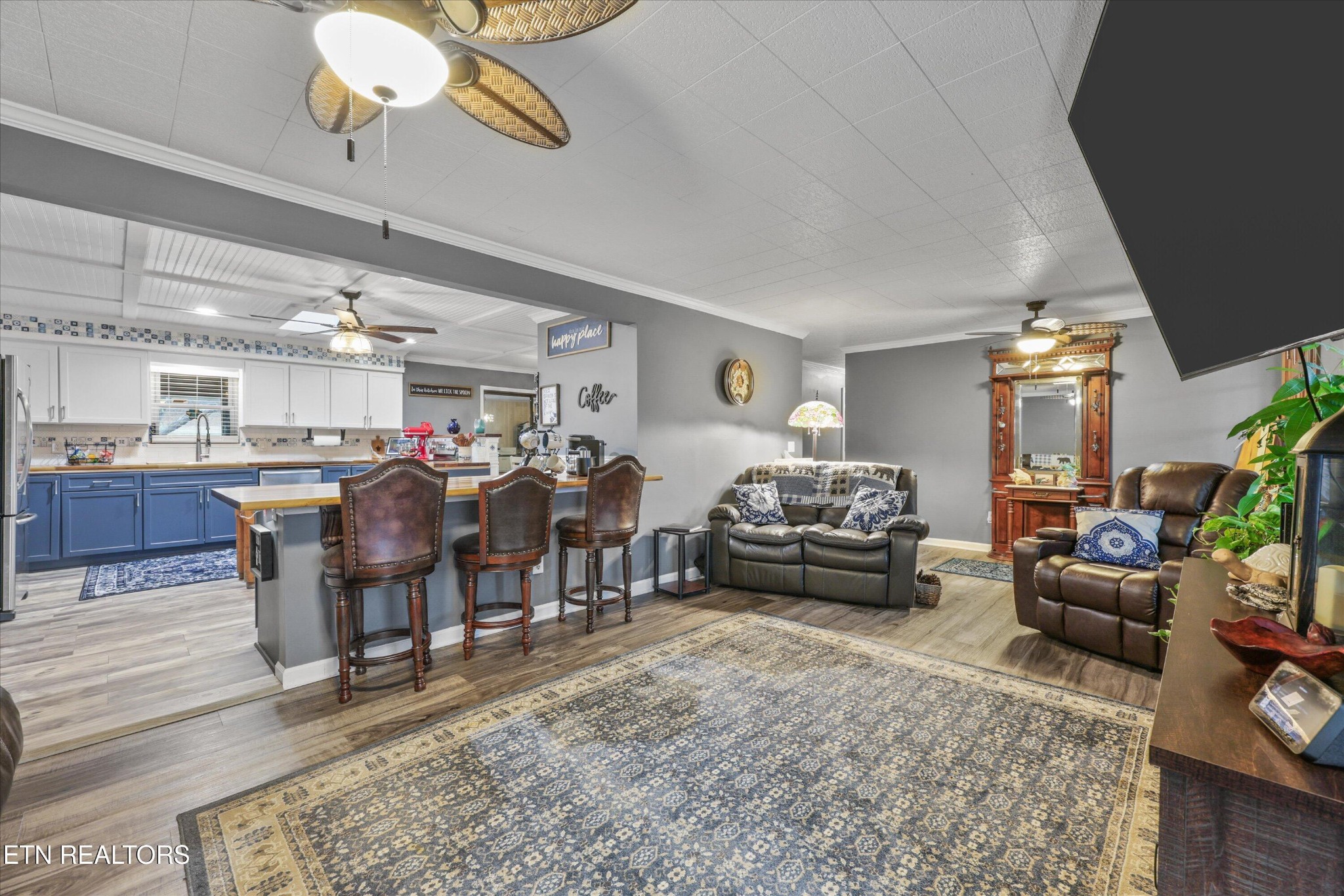 222 Mealer Road Lenoir City, TN 37771 - Photo 14 of 29 a living room with lots of furniture and a chandelier