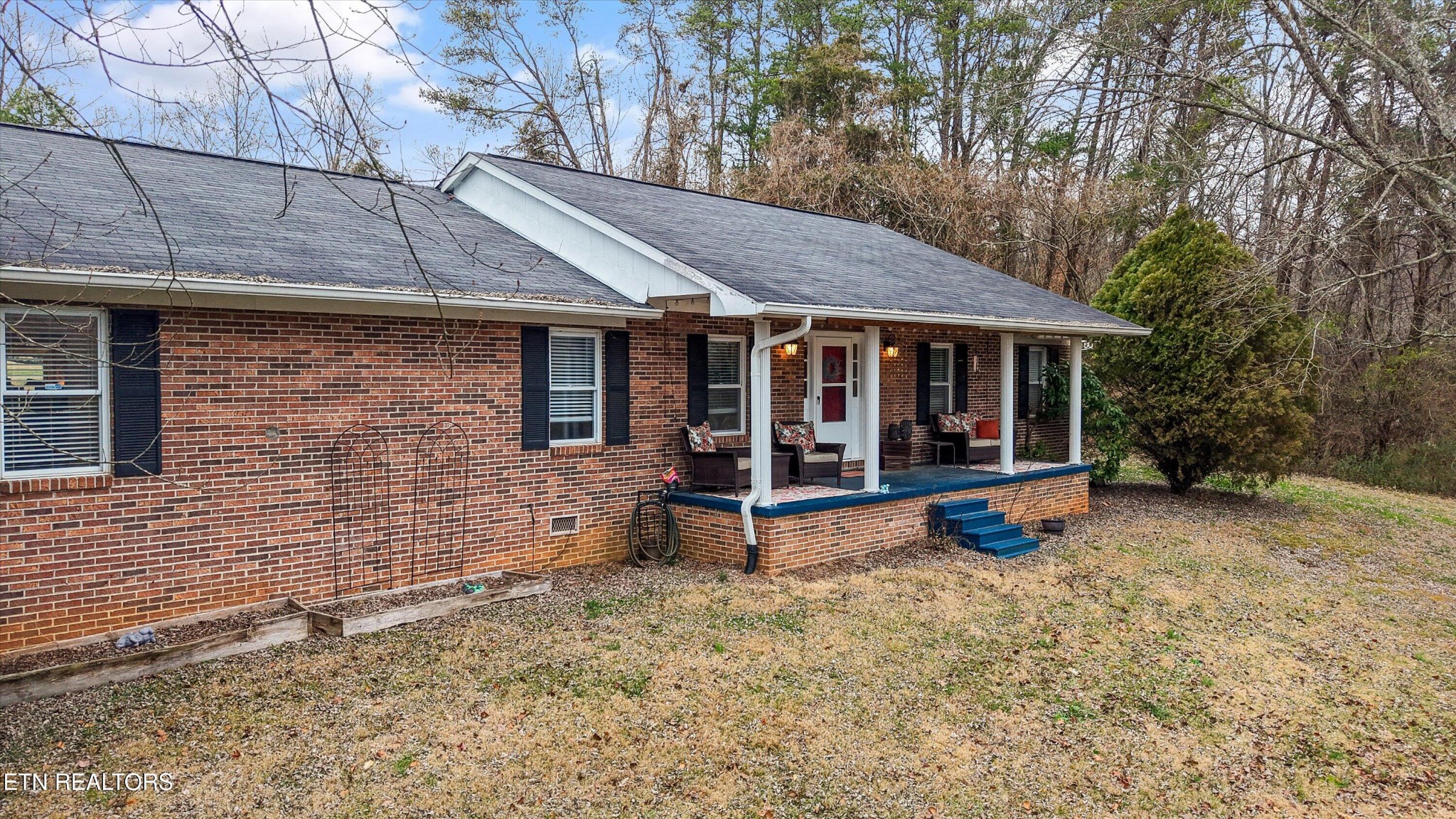 222 Mealer Road Lenoir City, TN 37771 - Photo 2 of 29 a view of a house with a yard and wooden fence