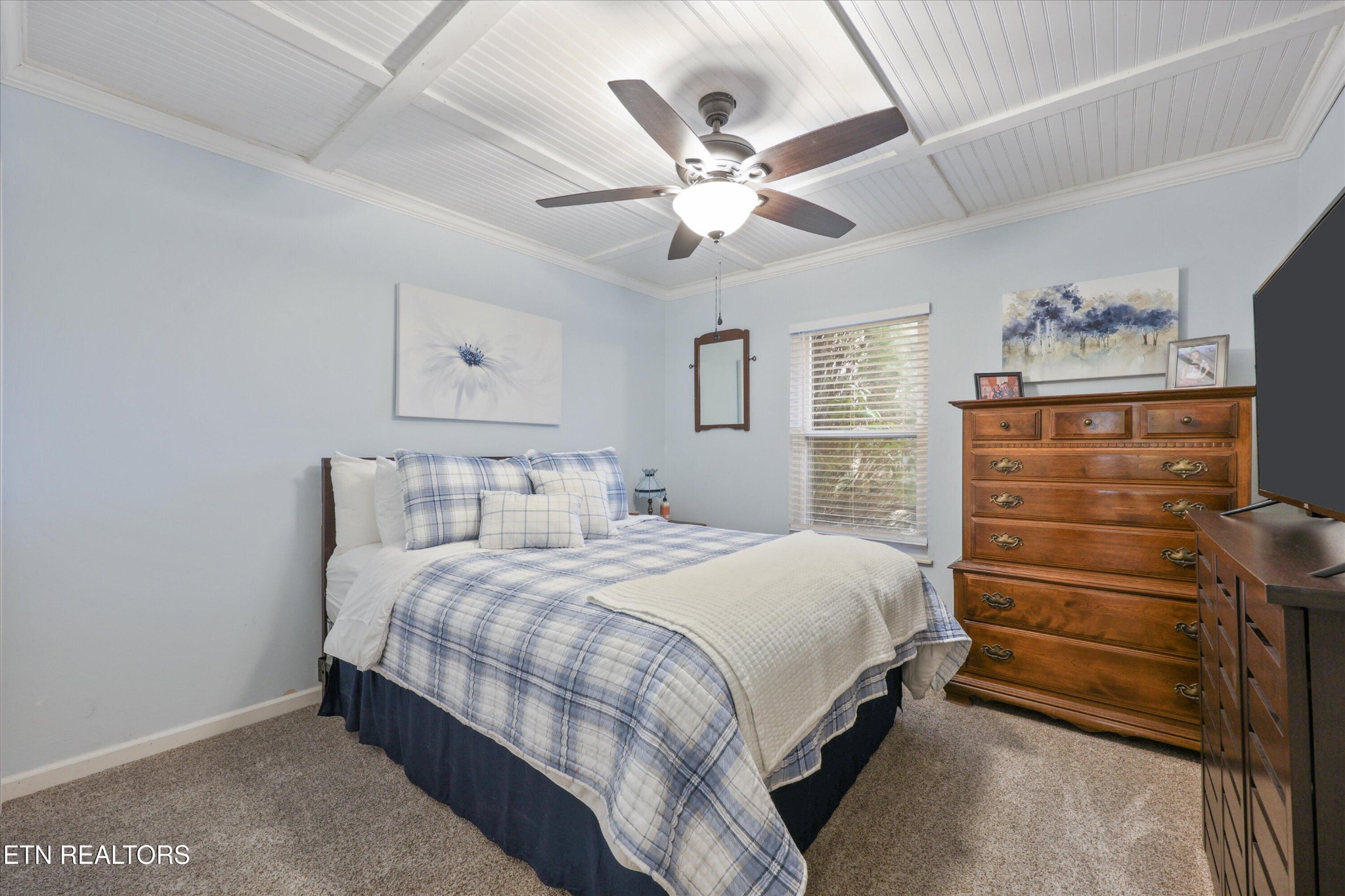 222 Mealer Road Lenoir City, TN 37771 - Photo 21 of 29 a bedroom with a bed and a chandelier