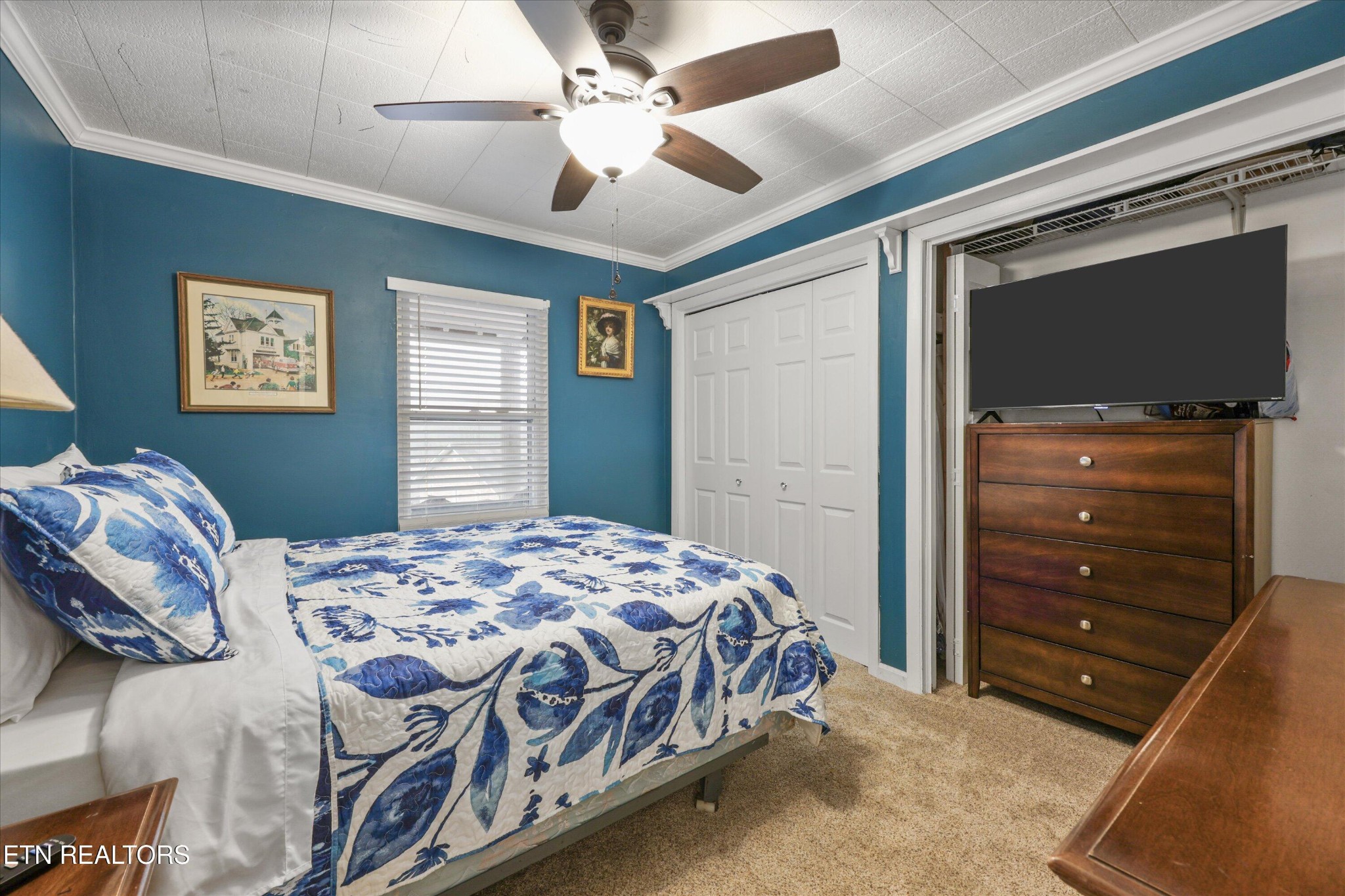 222 Mealer Road Lenoir City, TN 37771 - Photo 23 of 29 a bedroom with a bed and a chandelier
