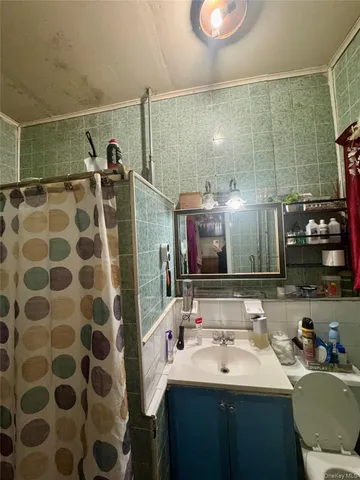 a bathroom with a granite countertop and a sink