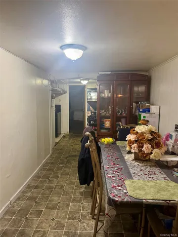 a bed room with two bed and a chair