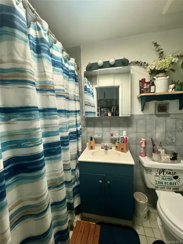 a kitchen with granite countertop a stove a sink dishwasher and cabinets