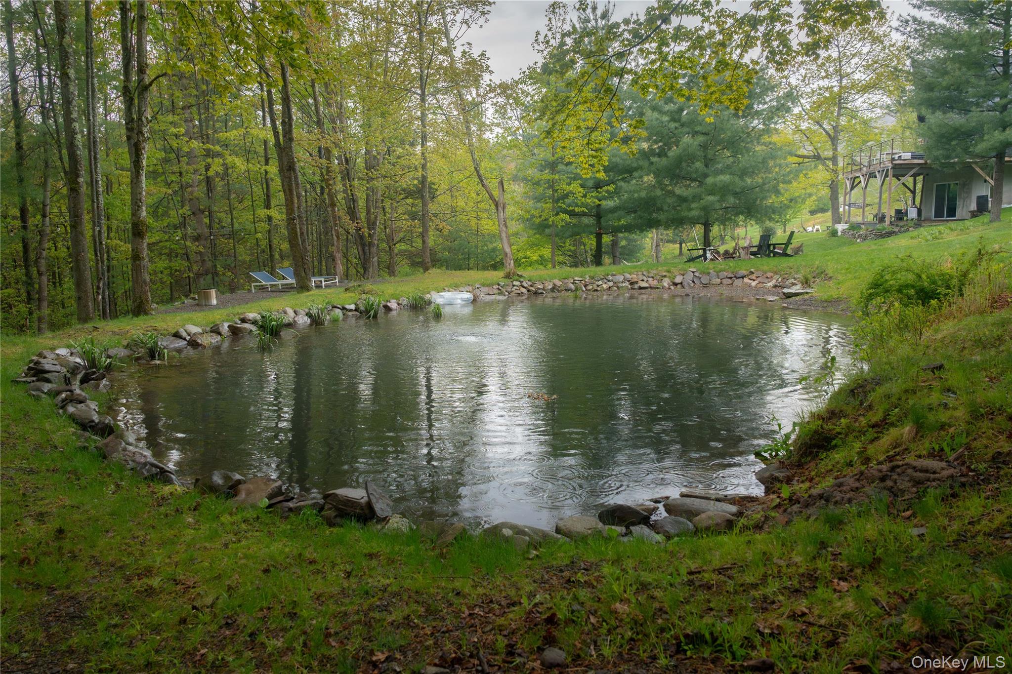22 Mc Guffey Road Kerhonkson, NY 12446 - Photo 20 of 24 a view of a lake with a house in the background