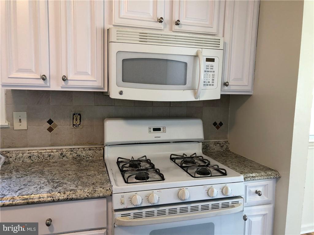 5813 Ravenswood Road Riverdale, MD 20737 - Photo 4 of 6 Bright white kitchen