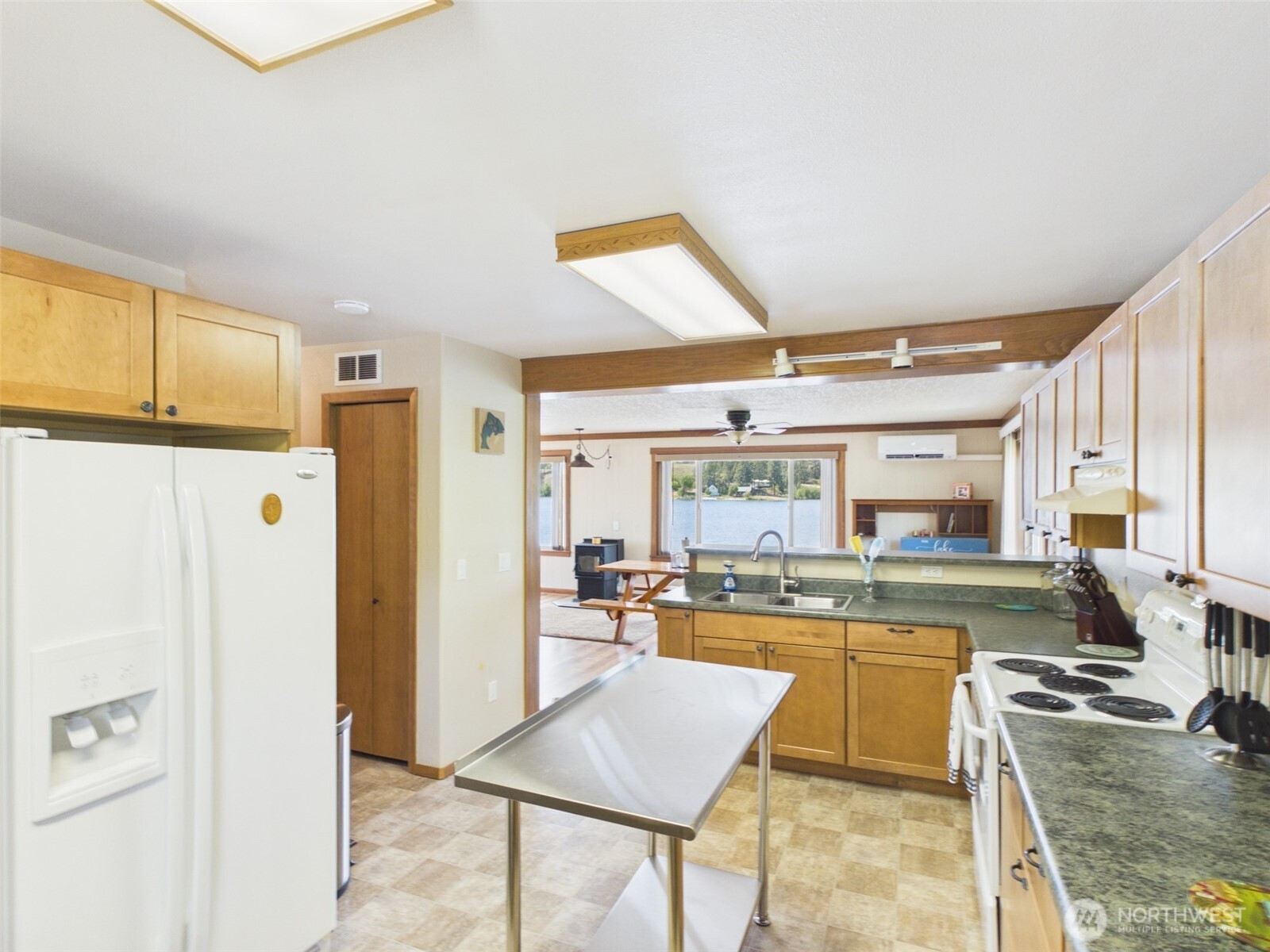 6 Marions Cove Road Republic, WA 99166 - Photo 4 of 33 a kitchen with stainless steel appliances granite countertop a refrigerator and a stove top oven