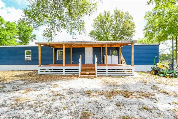 a house with trees in front of it
