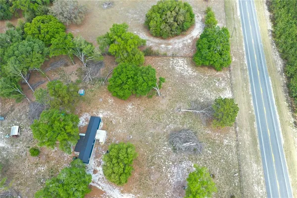 a view of a pathway with a yard