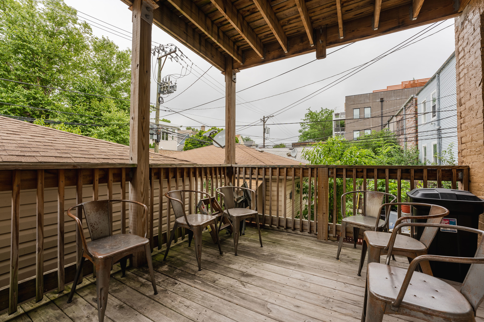 Undisclosed Address Chicago, IL 60614 - Photo 2 of 27 a balcony with wooden floor table and chairs