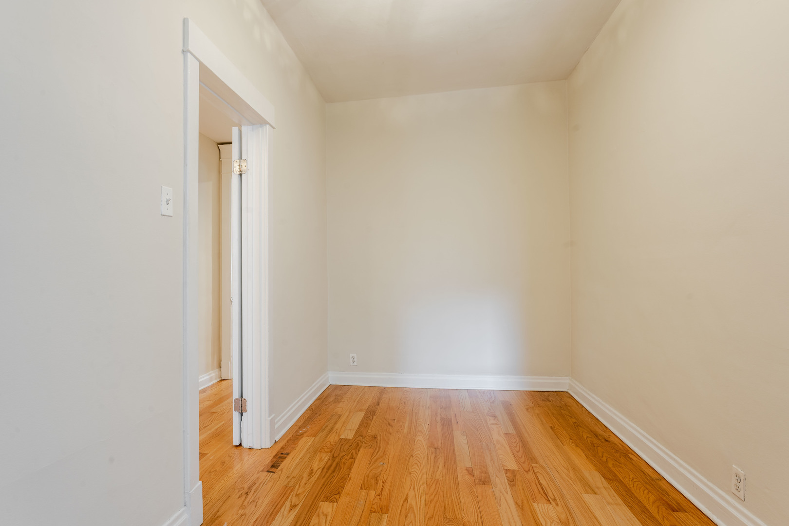Undisclosed Address Chicago, IL 60614 - Photo 13 of 27 a view of a room with wooden floor and a window
