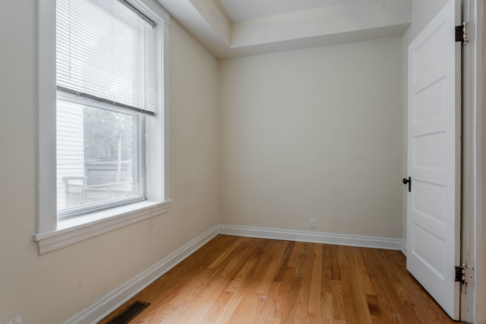 Undisclosed Address Chicago, IL 60614 - Photo 15 of 27 a view of an empty room with wooden floor and a window