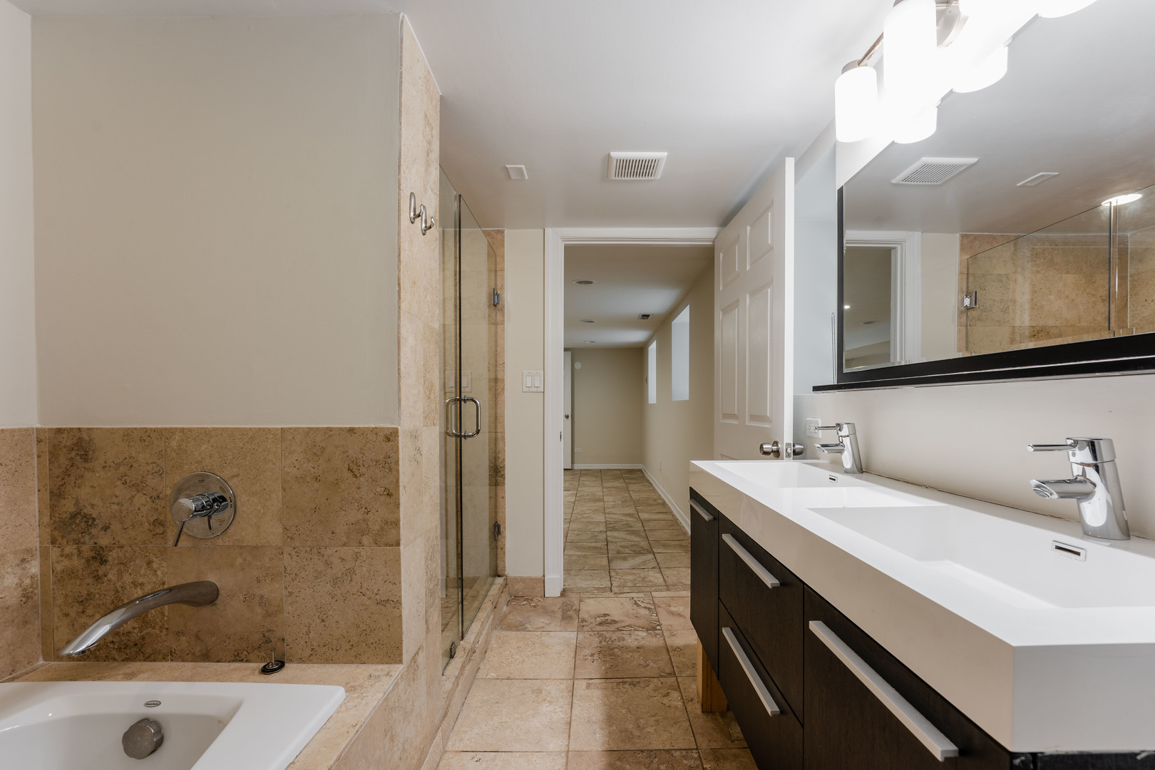 Undisclosed Address Chicago, IL 60614 - Photo 22 of 27 a bathroom with a sink a mirror and a bathtub