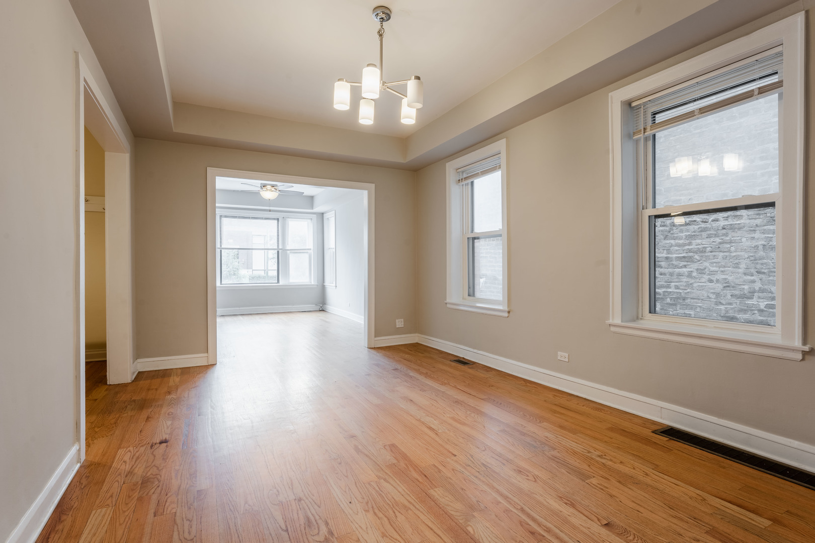 Undisclosed Address Chicago, IL 60614 - Photo 4 of 27 an empty room with wooden floor and windows