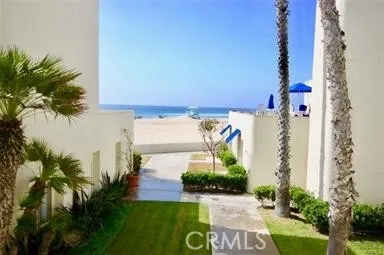 an aerial view of a house with garden space and street view