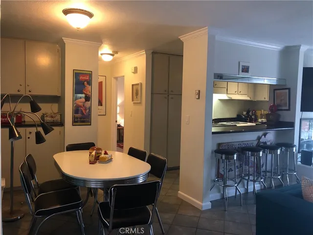 a kitchen with a table and chairs in it