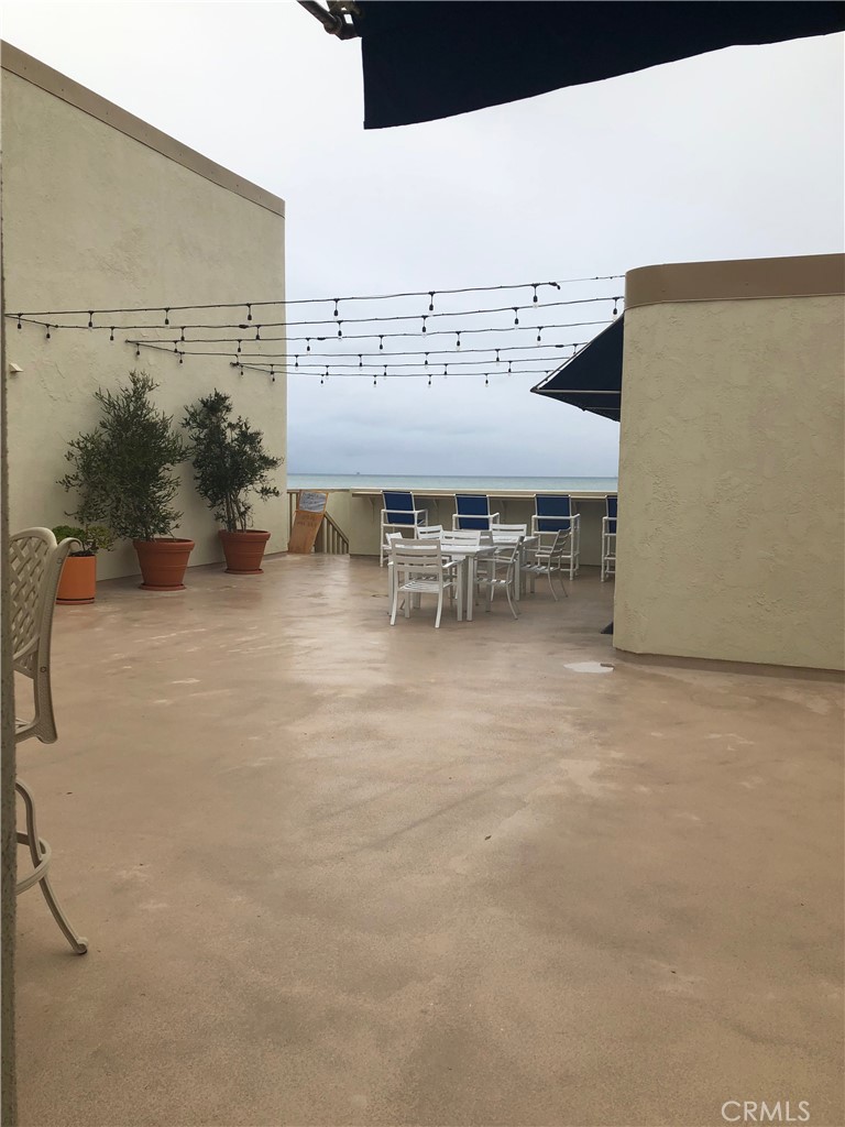 711 Pacific Coast Highway, Unit 303 Huntington Beach, CA 92648 - Photo 4 of 22 an outdoor space with furniture