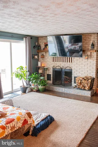 a bedroom with furniture and a potted plant