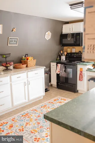 a kitchen with a stove and a microwave