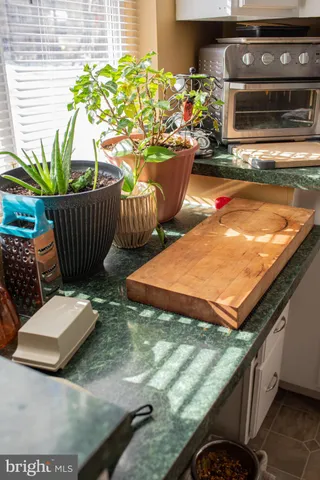 a view of a chairs and table in the balcony