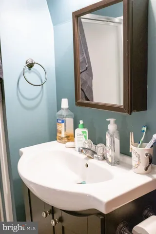a bathroom with a sink and a mirror