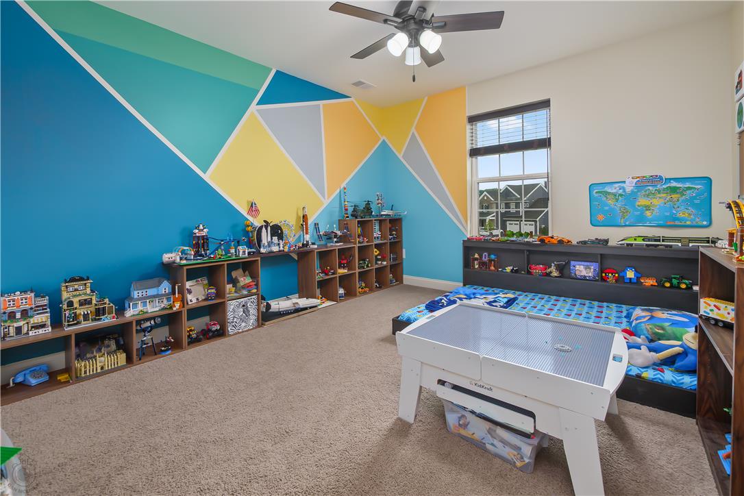 640 Rinaldi Lane Easton, PA 18040 - Photo 23 of 42 A vibrant bedroom features a unique geometric accent wall, creating a playful and inspiring atmosphere.