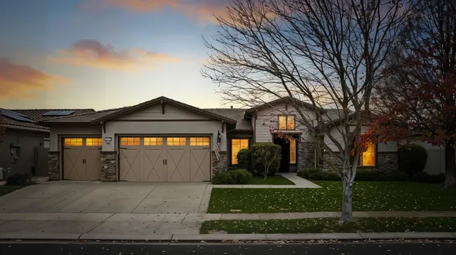 a front view of a house with a garage