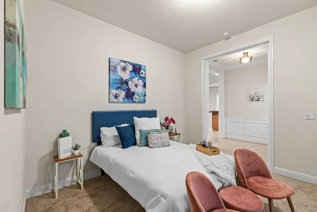 a bedroom with a bed and a window