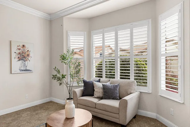 an aerial view of residential houses with outdoor space and parking