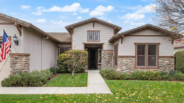 a front view of a house with a garage