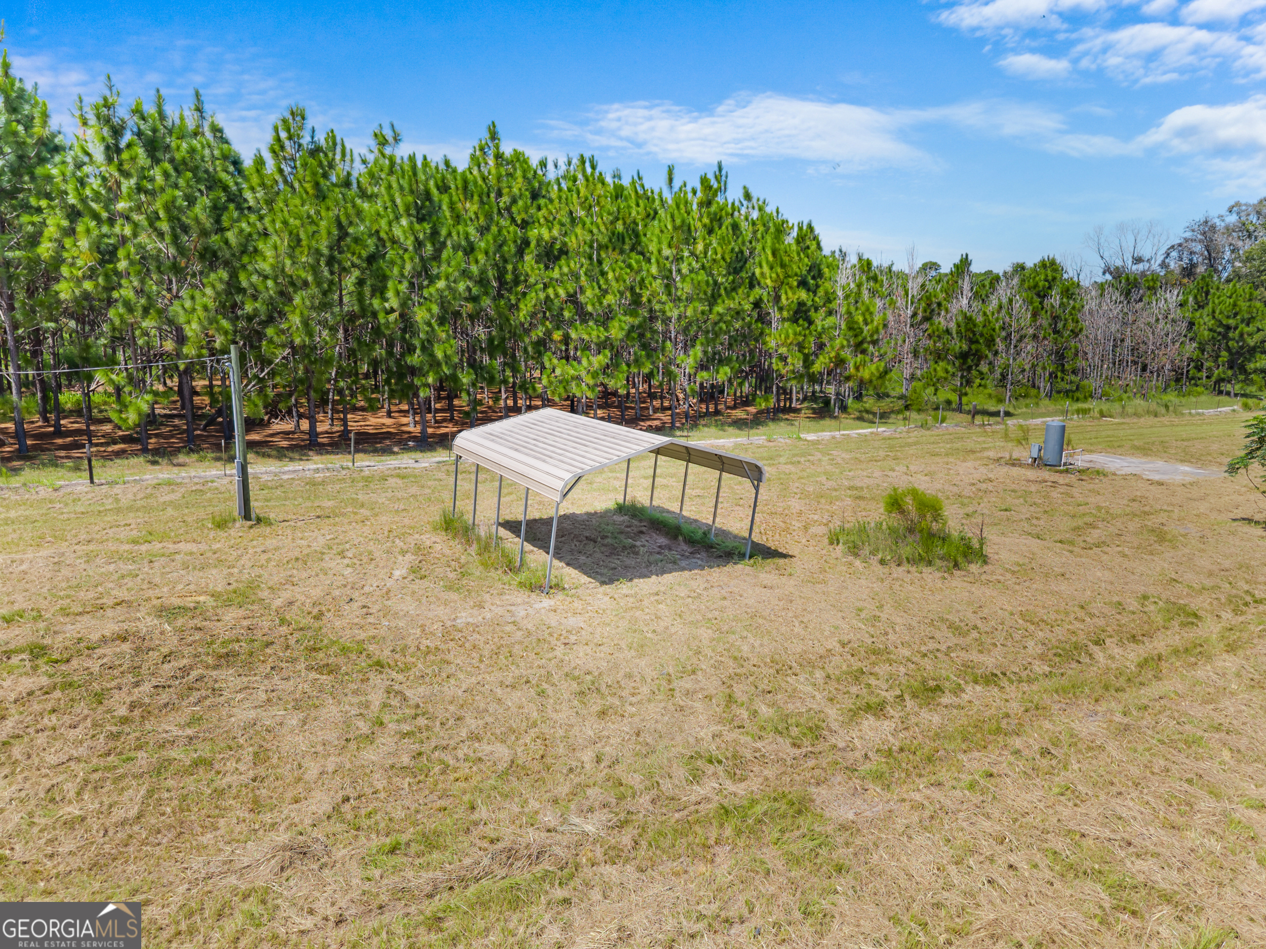 a backyard of a house with lots of green space