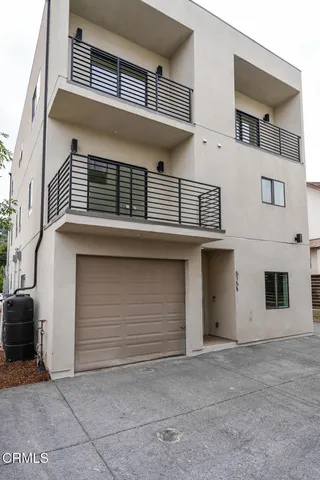 a front view of a house with garage