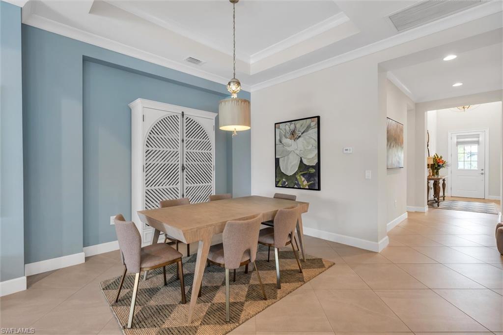 5769 Anegada Drive Naples, FL 34113 - Photo 14 of 45 a view of a dining room with furniture and window