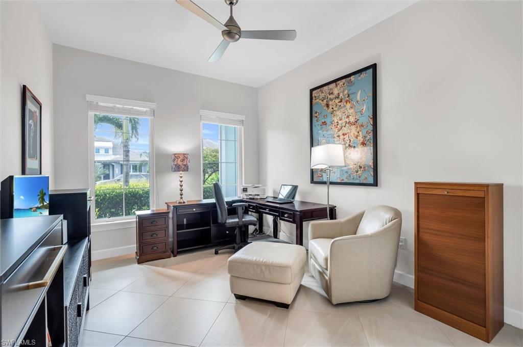 5769 Anegada Drive Naples, FL 34113 - Photo 16 of 45 a living room with furniture and a window