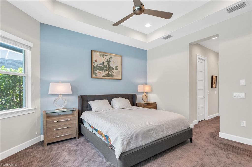 5769 Anegada Drive Naples, FL 34113 - Photo 22 of 45 a bedroom with a bed and a window