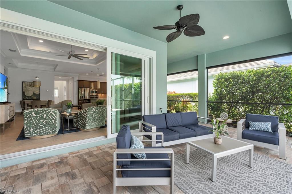 5769 Anegada Drive Naples, FL 34113 - Photo 27 of 45 a living room with furniture and a large window