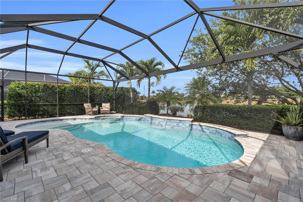 5769 Anegada Drive Naples, FL 34113 - Photo 30 of 45 a view of a swimming pool with a patio