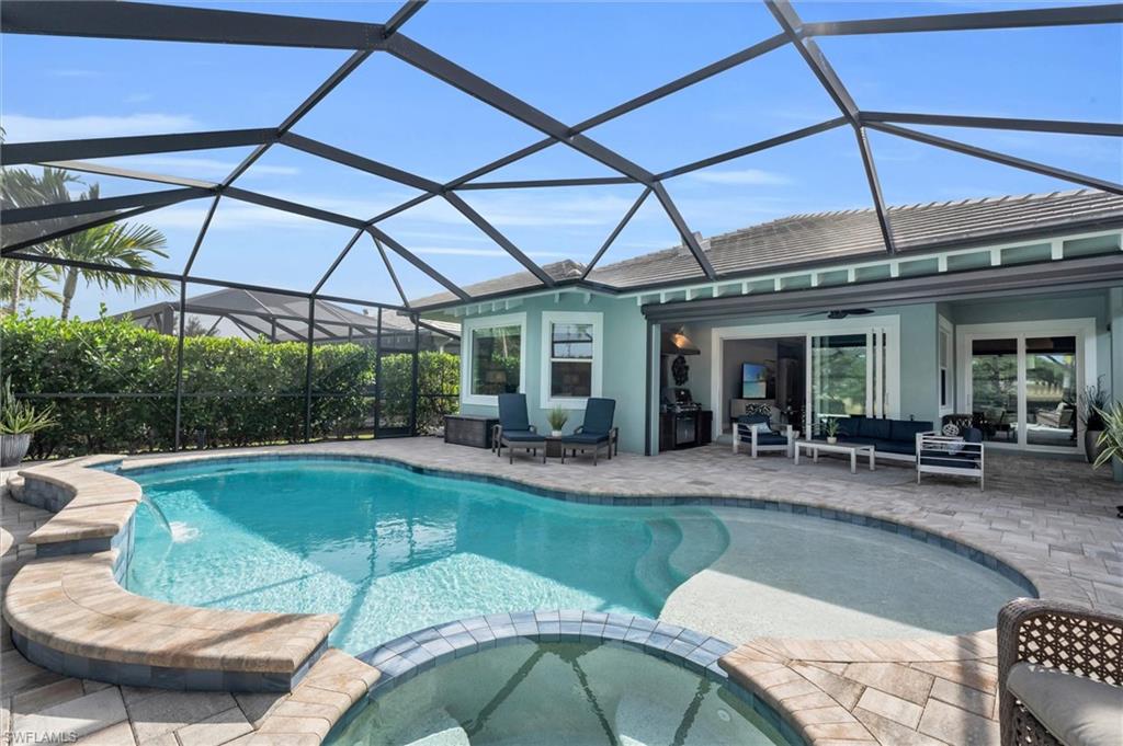 5769 Anegada Drive Naples, FL 34113 - Photo 32 of 45 a view of a house with swimming pool and sitting area