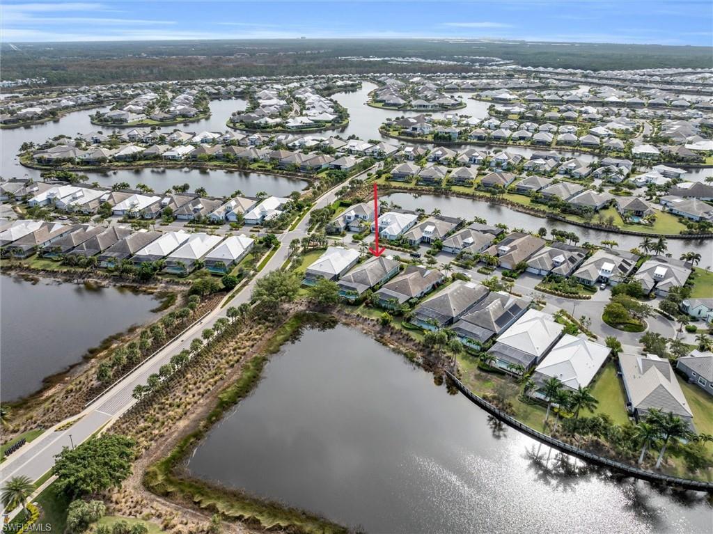 5769 Anegada Drive Naples, FL 34113 - Photo 36 of 45 an aerial view of city and lake view