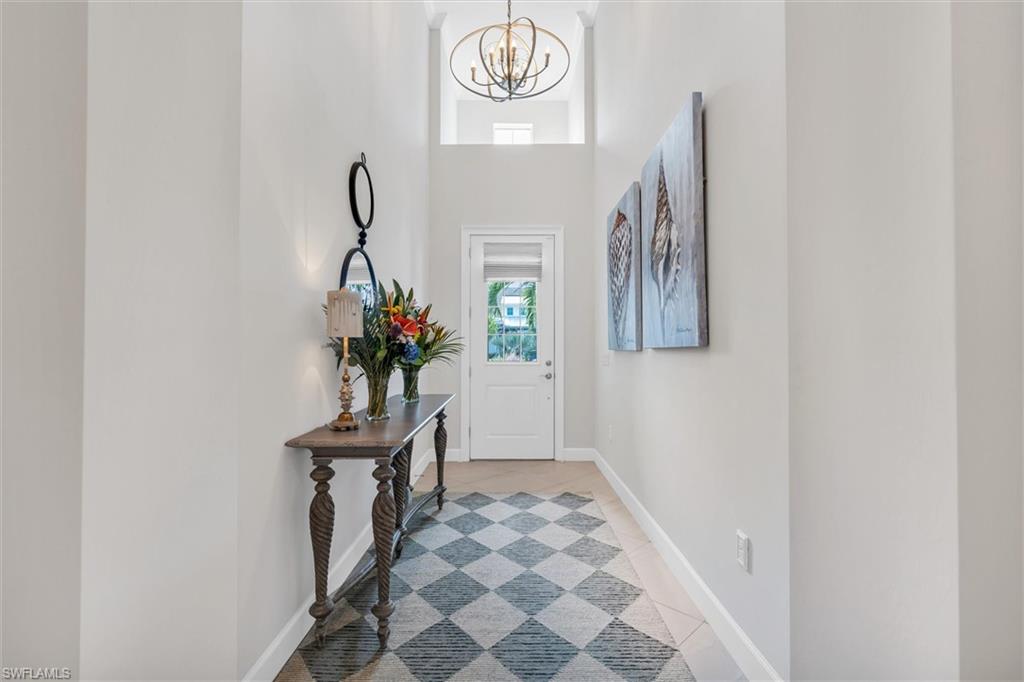 5769 Anegada Drive Naples, FL 34113 - Photo 4 of 45 a view of entryway with wooden floor