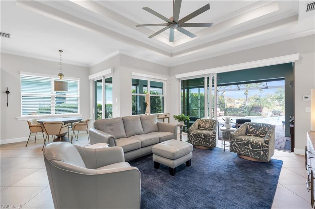 5769 Anegada Drive Naples, FL 34113 - Photo 5 of 45 a living room with furniture and a large window