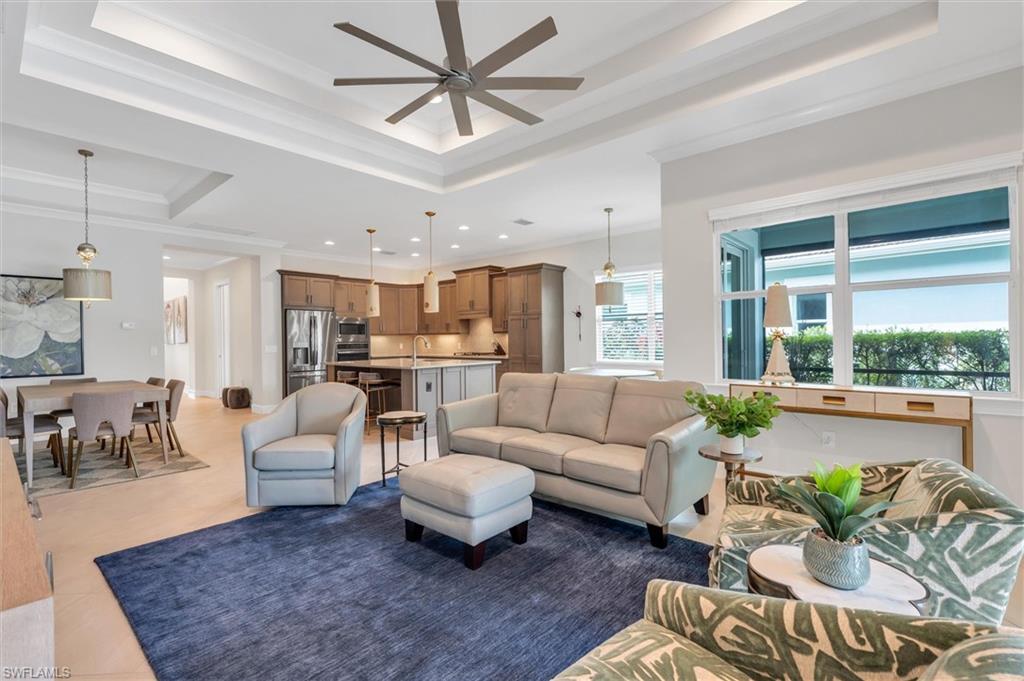 5769 Anegada Drive Naples, FL 34113 - Photo 8 of 45 a living room with furniture and a large window