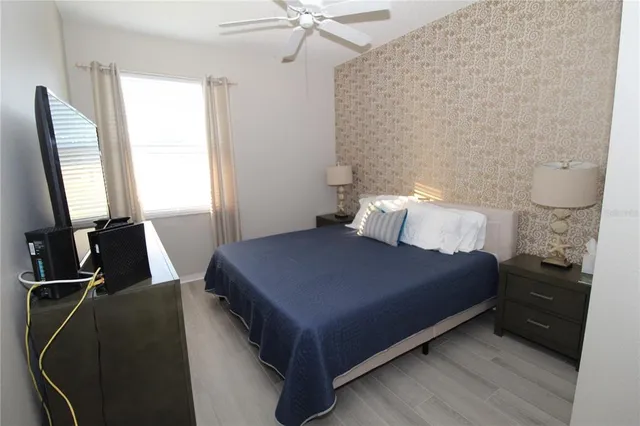 a bedroom with a bed and window