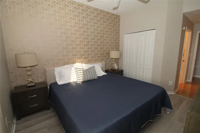 a bedroom with a bed and a bathroom