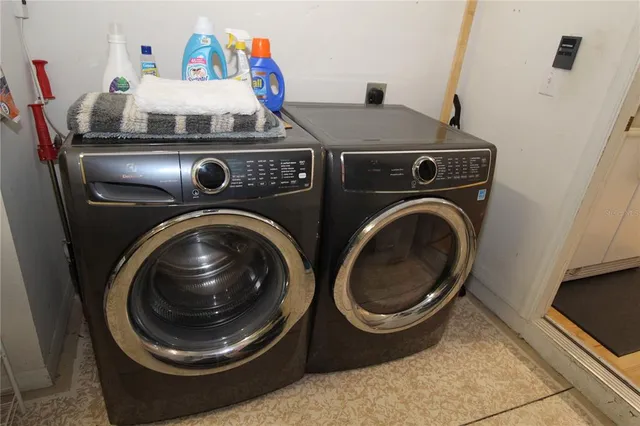 a utility room with dryer and washer