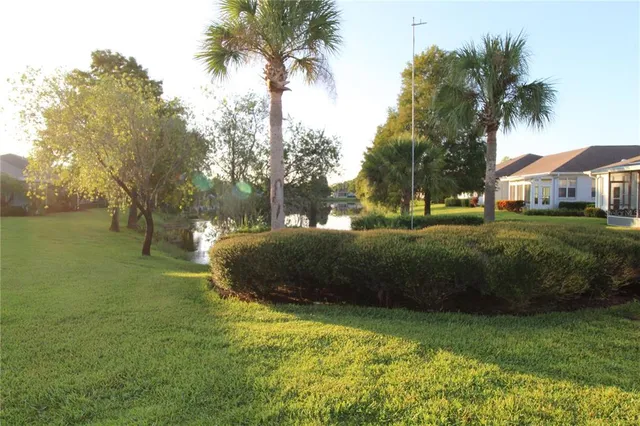 a view of outdoor space with garden and trees
