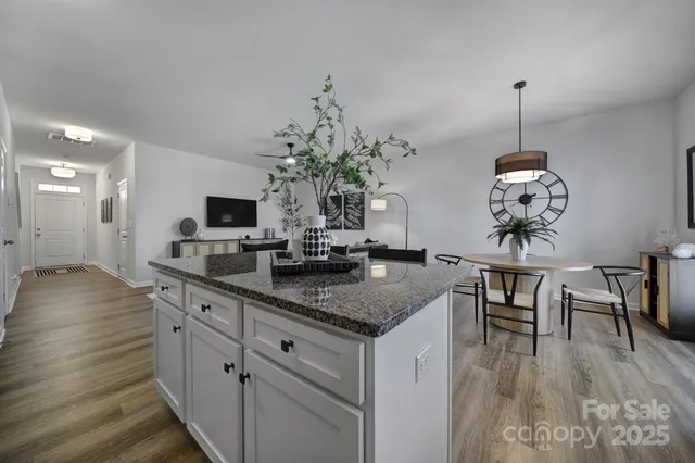 a kitchen with sink and cabinets