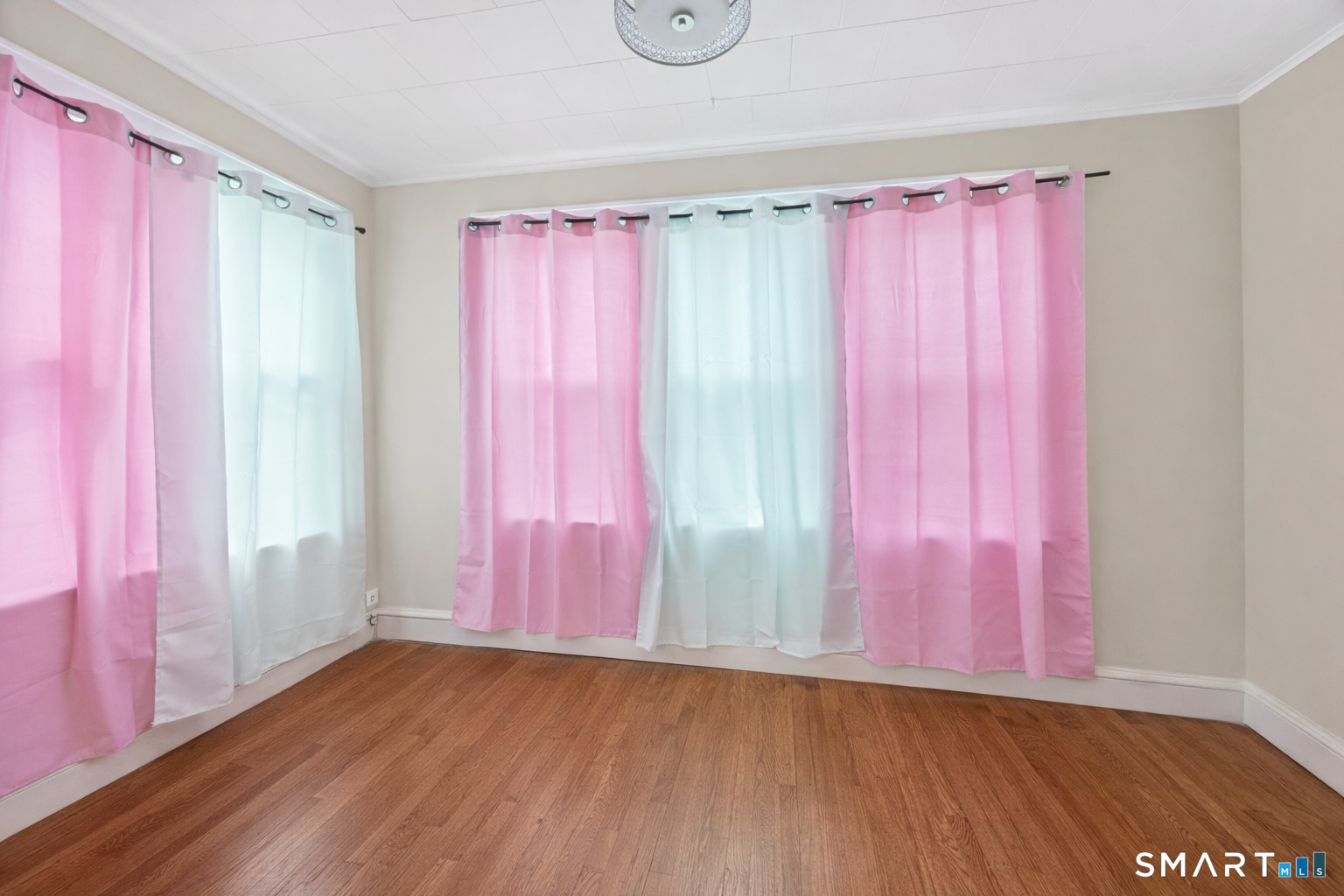 744 Park Street Bridgeport, CT 06608 - Photo 12 of 21 a view of a room with wooden floor and walls window
