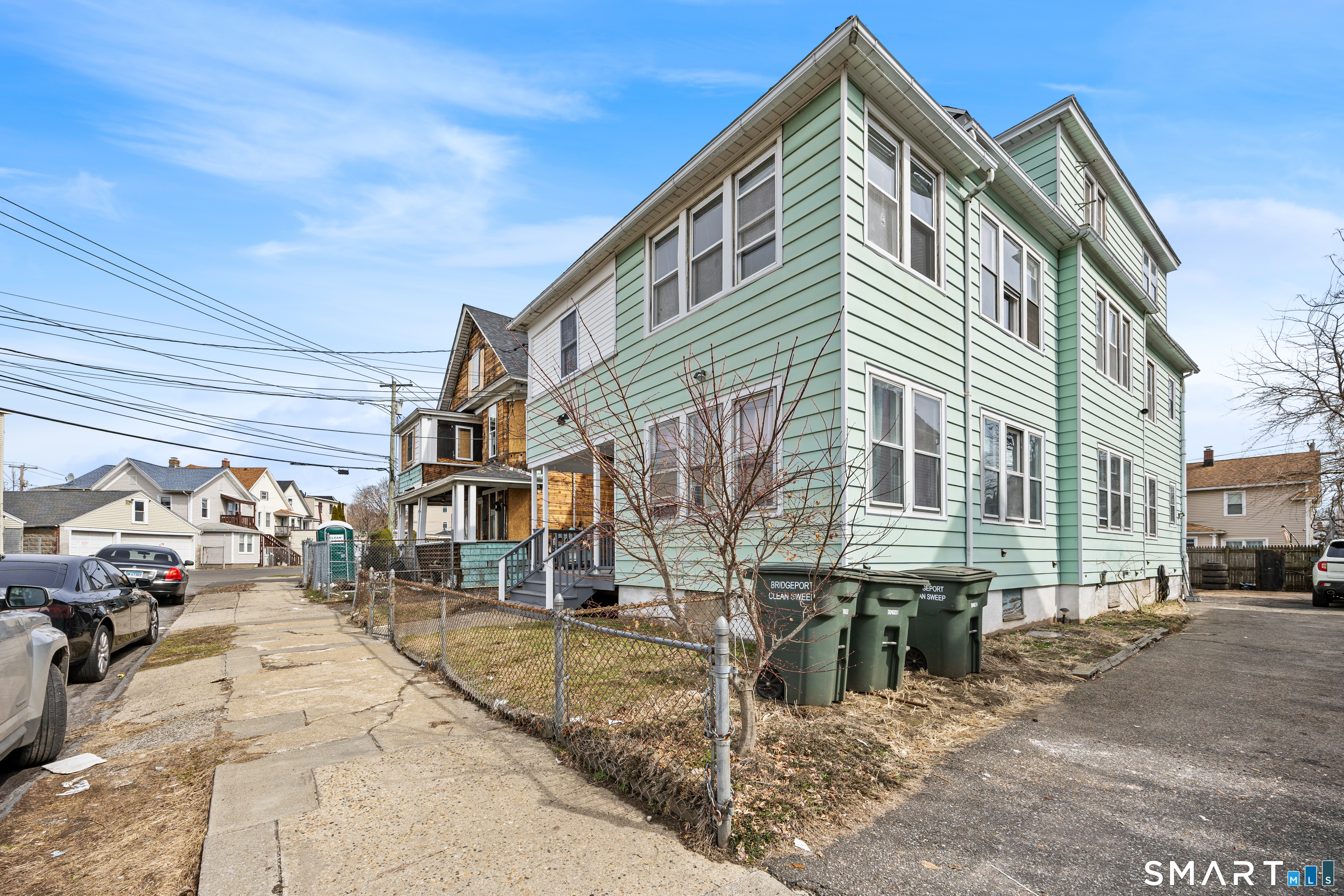 744 Park Street Bridgeport, CT 06608 - Photo 2 of 21 a city street lined with buildings and cars
